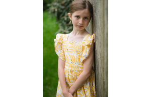 Girl modeling vintage dress in bananas print