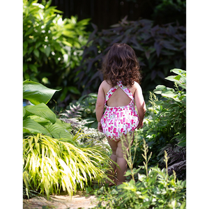 Back view of toddler in summery bubble romper